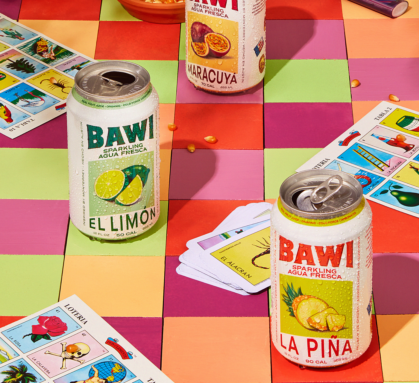 An image of Bawi cans on a table with cards